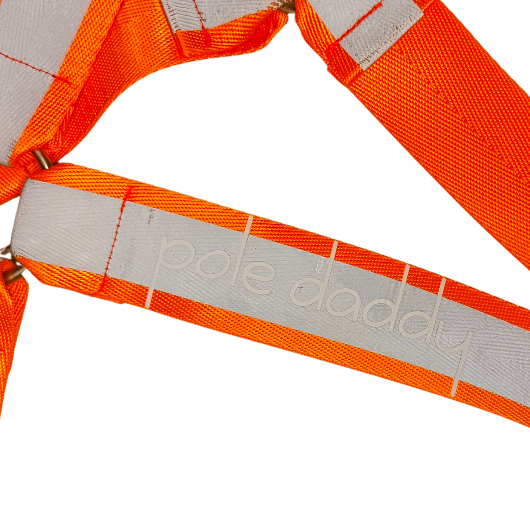 Close up of Pole Daddy on rear of tradie harness in orange