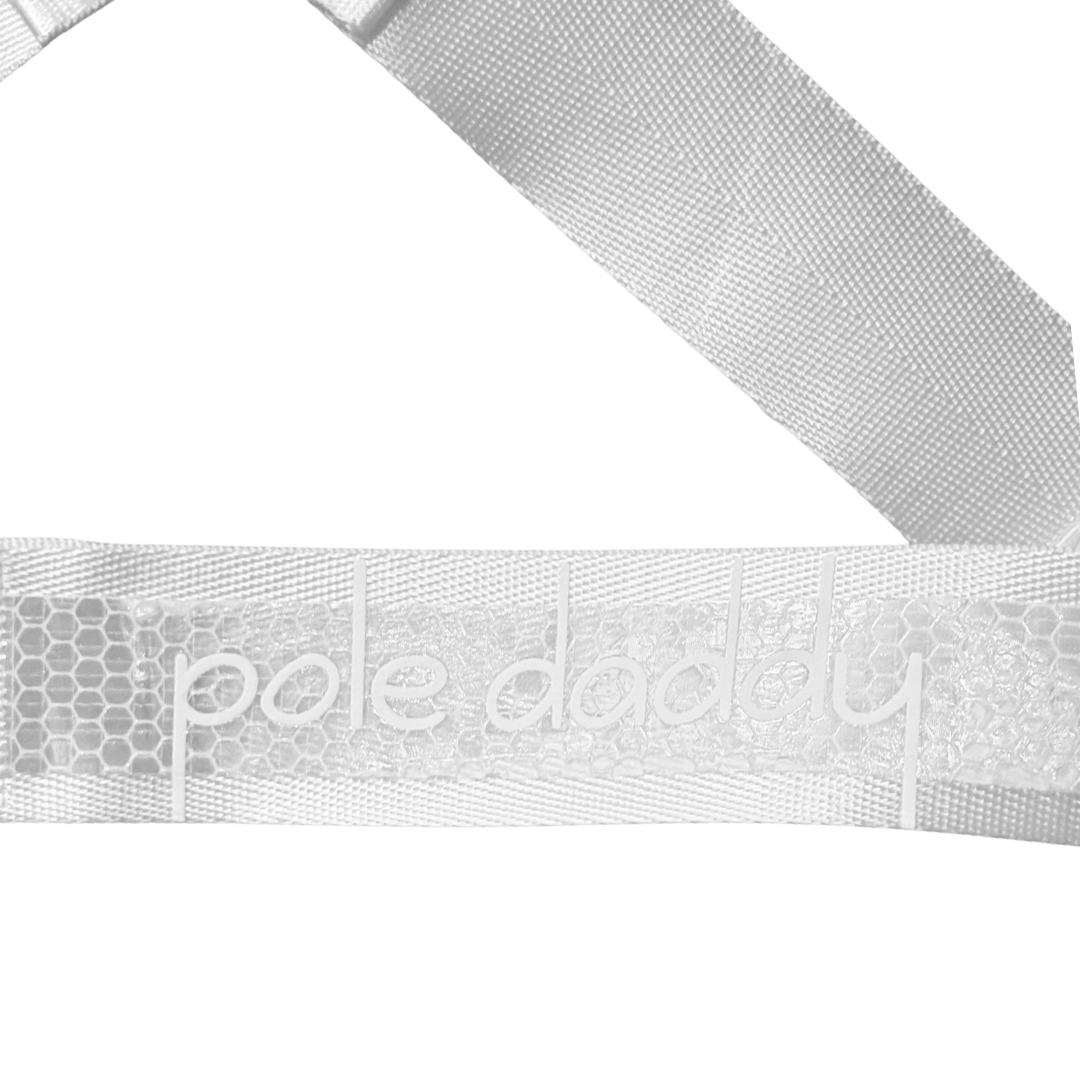 Close up of Pole Daddy logo the rear of Lustrum White Reflective Harness